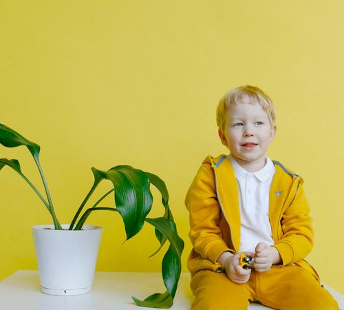 Clean and safe yoga studio for kids with colorful mats and props.